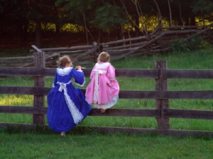 young girls in colonial garb at historic farm